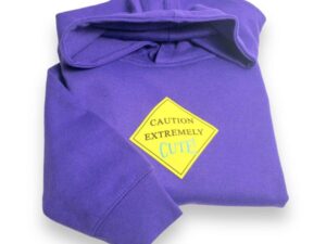 A purple hoodie with a yellow caution sign on it.