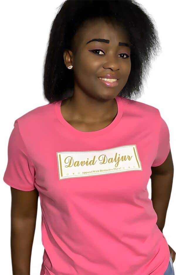 A woman wearing a pink shirt with the name of david saljas on it.