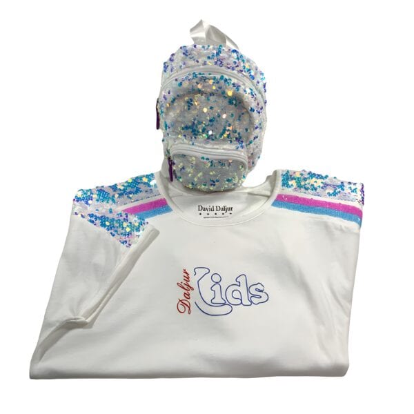 A white bib and hat with blue, pink and purple designs.