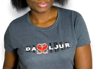 A woman wearing a gray t-shirt with the name of daljur on it.