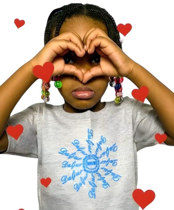 A girl making a heart with her hands