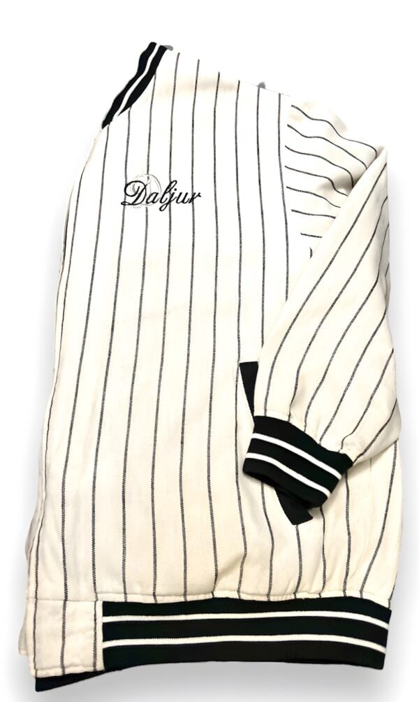 A white and black striped baseball uniform with the name of dalfur embroidered on it.