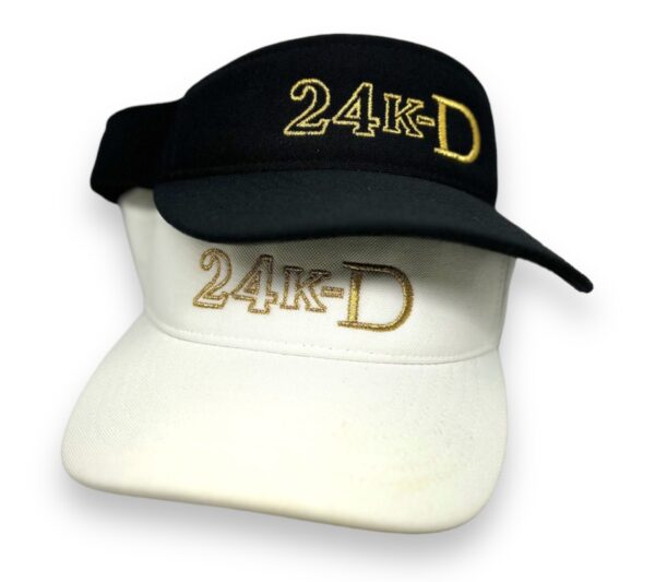 A black and white hat with the words " 2 4 k-d ".