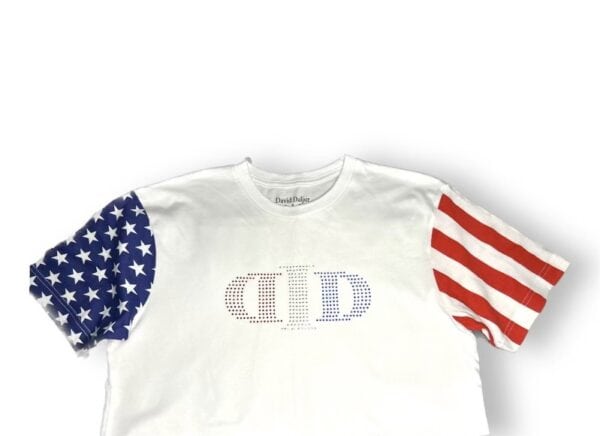 A white shirt with an american flag and baseball logo on it.